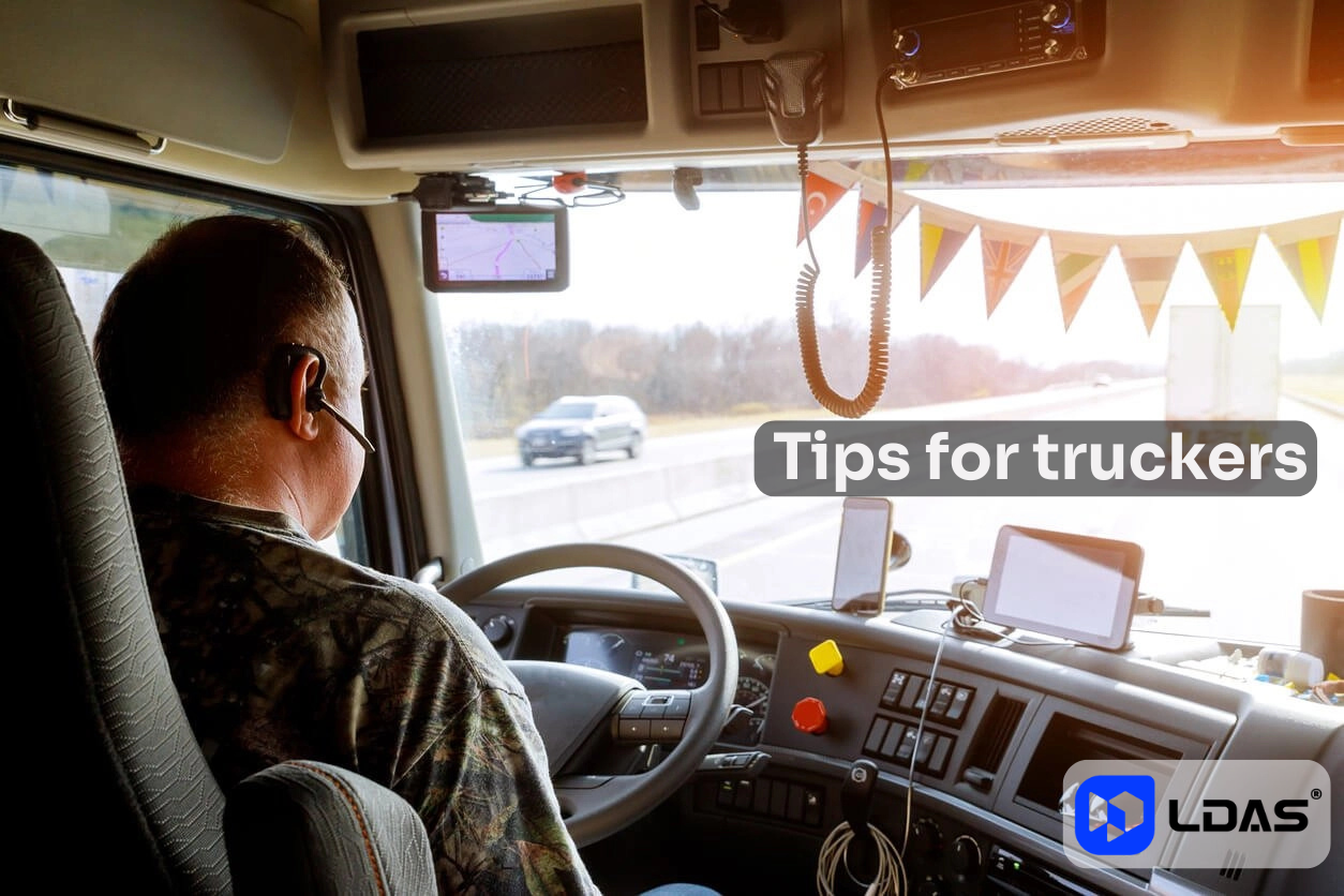 Canadian truck driver wearing LDAS G10 Bluetooth headset while driving across the Trans-Canada Highway.